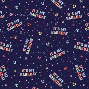 Colorful rainbow barkday design with confetti paws and happy birthday text for dogs on deep navy 
