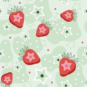 Strawberries and stars on a gentle green background  