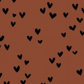 Sweet love on linnen texture hearts in boho style black on rust