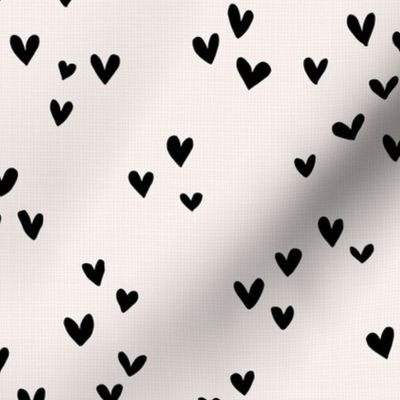 Sweet love on linnen texture hearts in boho style black on ivory