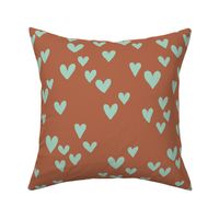 Solid hearts for valentine minimalist heart shapes pattern nursery texture mint green on rust brown