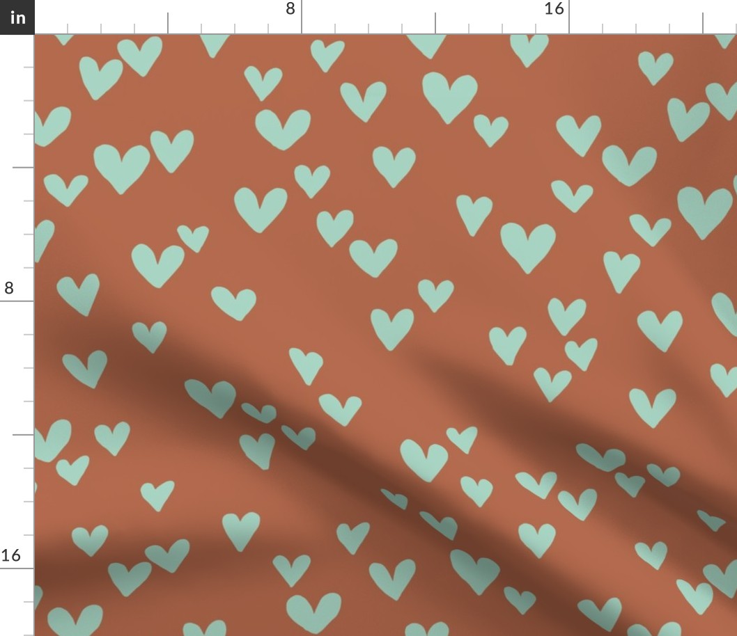 Solid hearts for valentine minimalist heart shapes pattern nursery texture mint green on rust brown