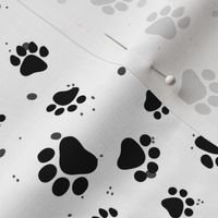 Abstract black and white cat paw pattern with dots