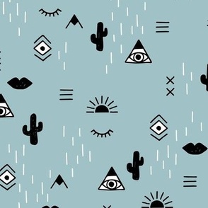 Western freehand sunrise with mountains aztec details cacti and indian summer elements black and white on warm blue