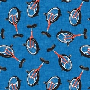 Unicycles - orange on blue - bike sports - LAD21