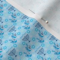 tiny hanukkah designs and snowflakes on blue