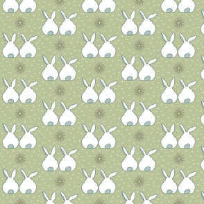 white rabbit friends on green background