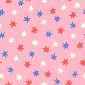 White, red and blue stars on pink