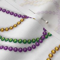 Mardi Gras Beads Tossed on White