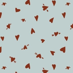 tossed hearts with arrows - rusty red on seafoam 