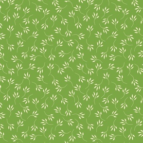 scattered cream branches on a fresh green background