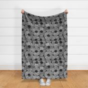 Rock and Roll Gray Scale Toilet Paper Rolls Overlaid with Rocks