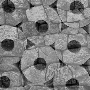 Rock and Roll Gray Scale Toilet Paper Rolls Overlaid with Rocks