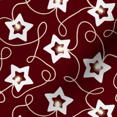 Scattered Star Christmas String Light decoration on burgundy red