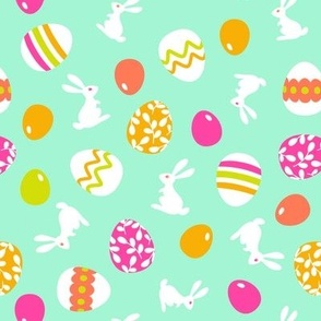 Easter bunnies and eggs on mint green