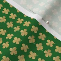 Gold glitter four leaf clover on green  small