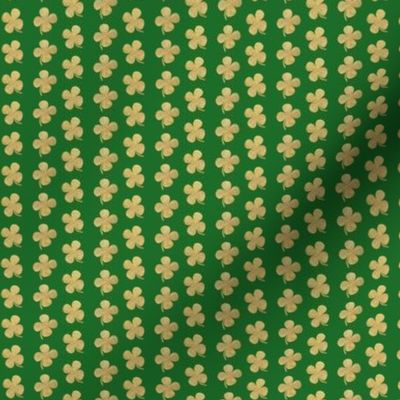 Gold glitter four leaf clover on green  small