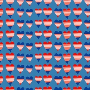 Red, white and blue hearts on a bright blue background