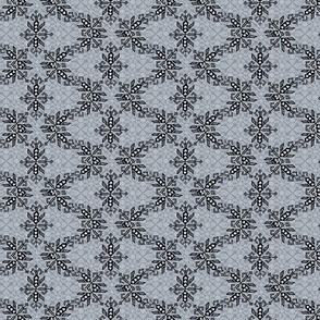 motif indien en noir et blanc sur fond floral gris clair