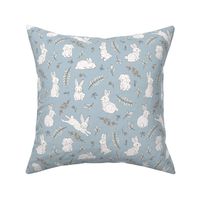 Romantic boho bunny garden rabbits and leaves vintage style freehand illustration easter design white rust on moody blue