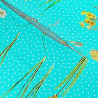 Daffodils and polka dots on aqua ground