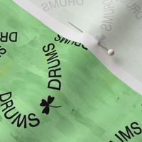 Drums Shamrock Text Green Background
