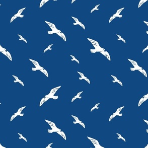 Blockprint seagulls white on blue-medium