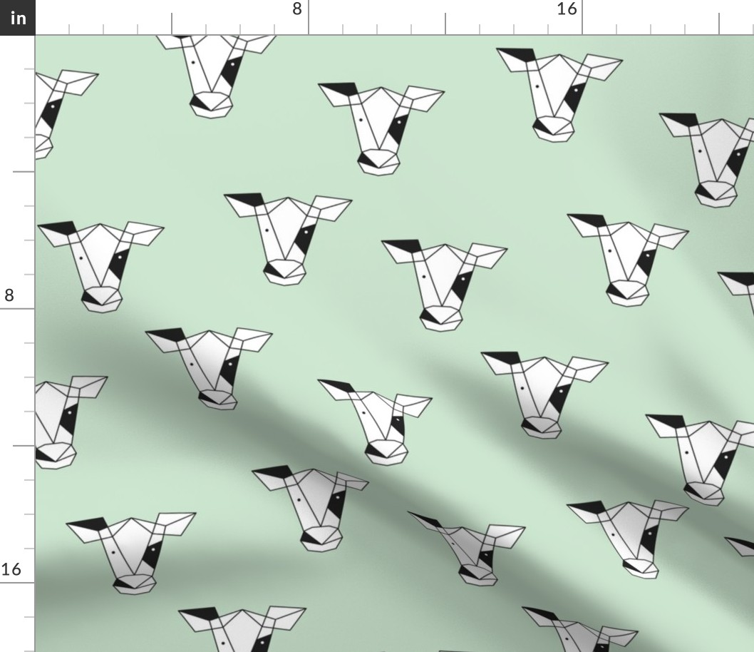 Geometric black and white cow abstract farm animals design for kids on fresh spring mint green 
