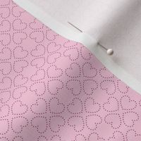 small pink dotted valentine hearts on light pink
