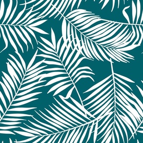 palm leaves on emerald green