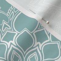 Boho white floral mandala on light blue background