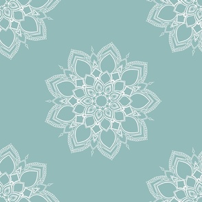 Boho white floral mandala on light blue background