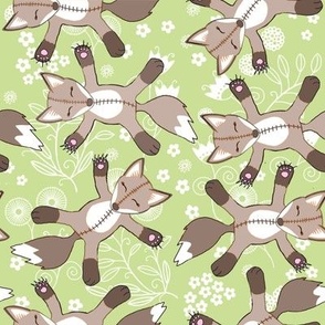 Fox teddies on  green flowery background