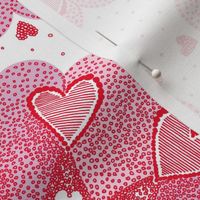 red hearts drawn by hand on a white background 