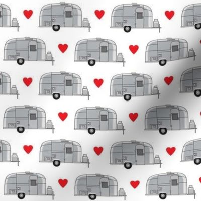 small vintage aluminum trailers with red hearts