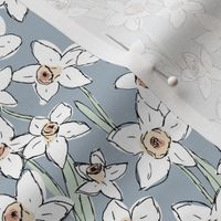 Raw freehand daffodils boho garden daffodil blossom spring love baby nursery white mint on moody blue sky 