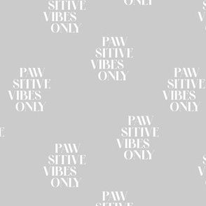 Pawsitive vibes only funny dog lovers quote text design for cute puppies and dogs white on soft gray