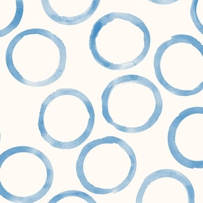 large blue circles cream background