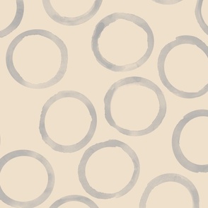 large grey circles on beige background