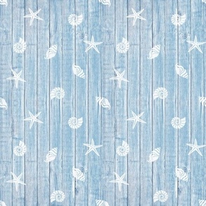 seaside blue woodboard with white seashells