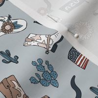 Little cowboy freehand western illustrations texas ranch life with longhorn skull flag boots and cacti moody blue vintage red on soft blue gray mist