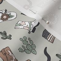 Little cowboy freehand western illustrations texas ranch life with longhorn skull flag boots and cacti vintage red sage green on mist