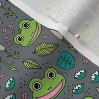 Funny happy frog pond sweet frogs friends english garden and river illustration lilies and leaves bright green pink blue on charcoal 