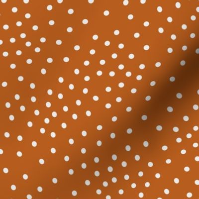 Scattered White Dots on Solid Burnt Orange Background