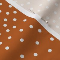 Scattered White Dots on Solid Burnt Orange Background