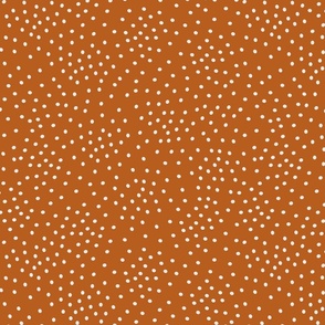 Scattered White Dots on Solid Burnt Orange Background