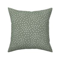 Scattered White Dots on Solid Sage Green Background