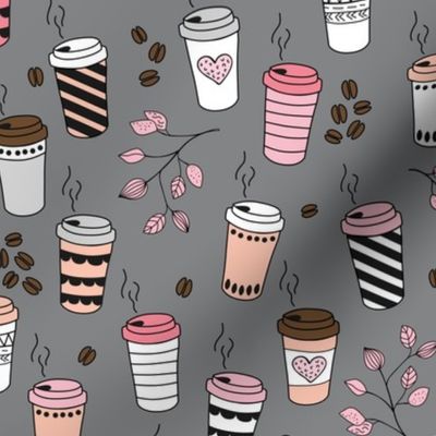 Good morning coffee to go with coffee leaves beans and  cups in peach pink on charcoal gray
