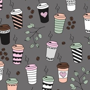 Good morning coffee to go with coffee leaves beans and  cups in mint green pink blush on gray