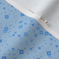 pixelated stars - bright blues on dusty pale blue - ELH